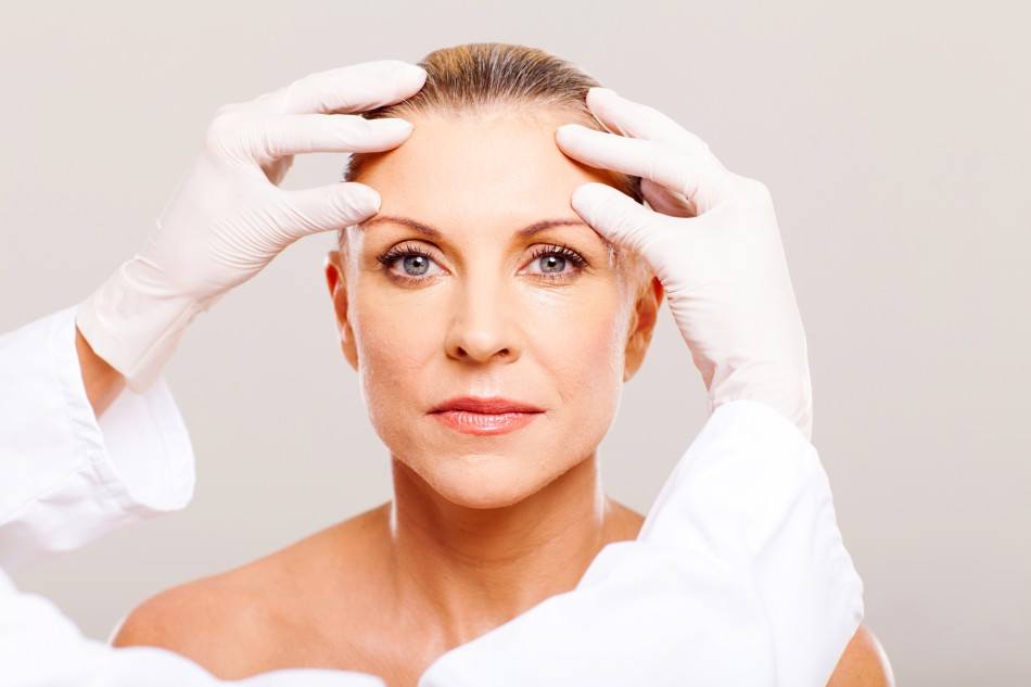 woman getting assessed by dermatologist Toronto