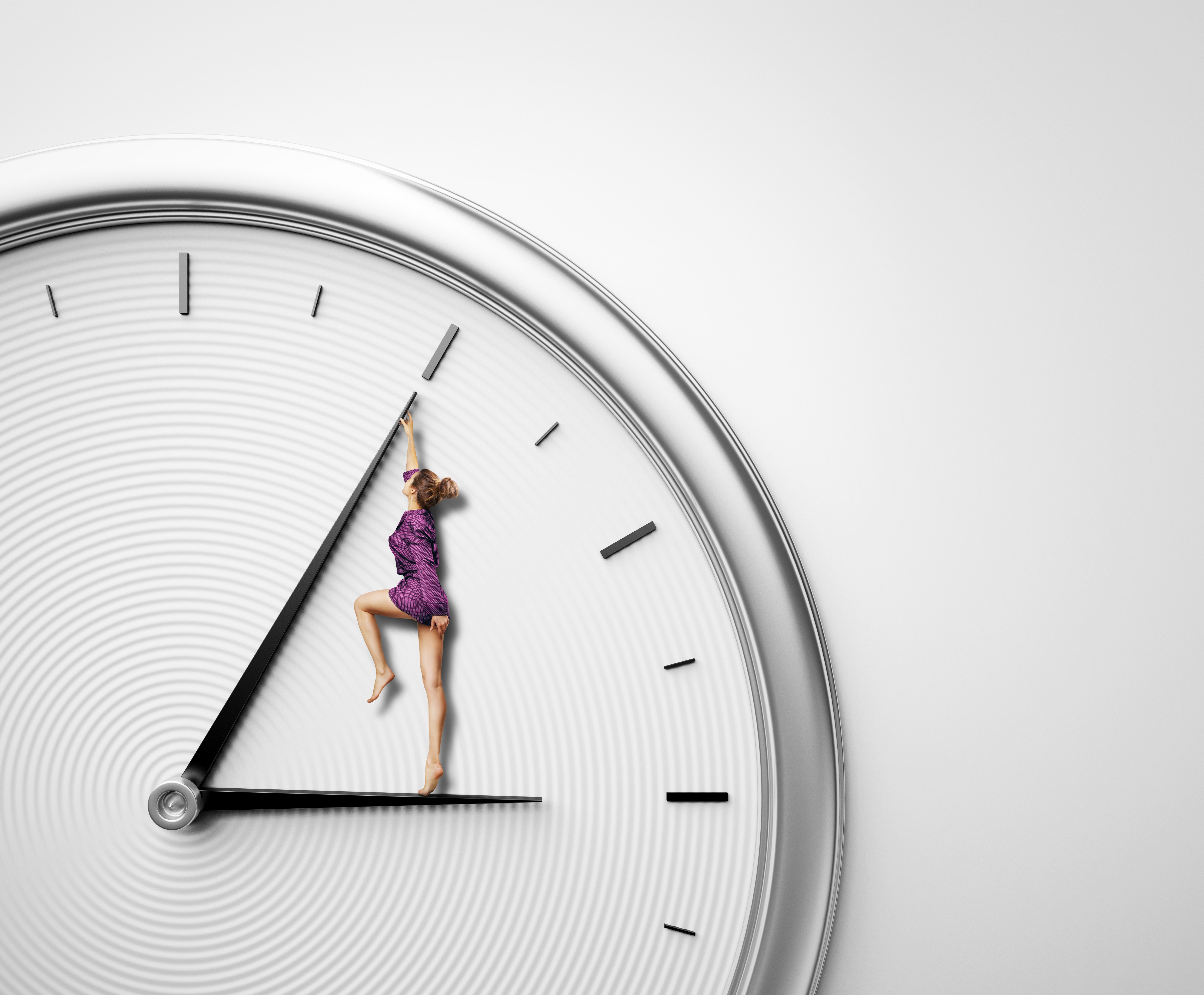 woman in a purple jumper standing on hour hand of clock and pushing minute hand backward