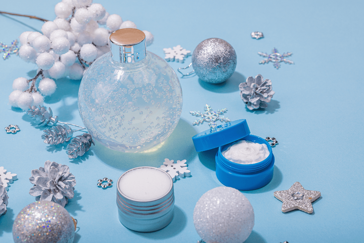 Blue Christmas baubles and cosmetics